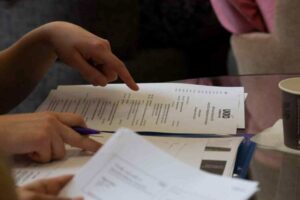 Person looking at a conference programme